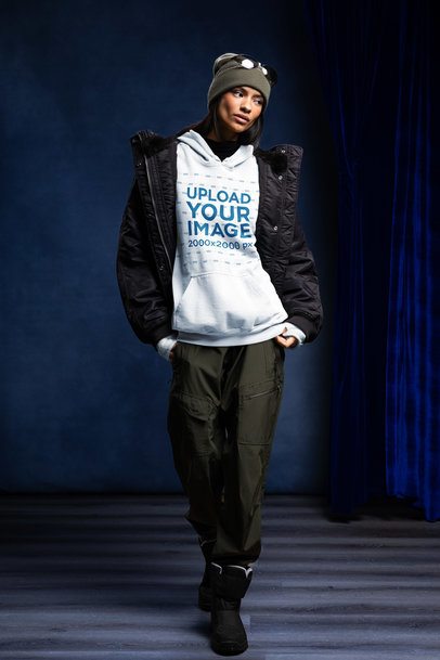 Winter Mockup of a Serious Woman Wearing a Comfort Colors 1567 Hoodie and a Ski Outfit m59242