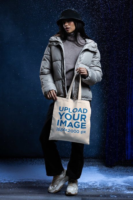 Tote Bag Mockup of an Attractive Woman in a Winter Theme