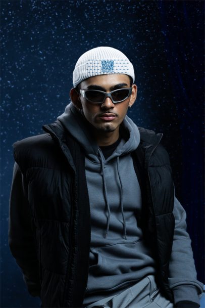 Beanie Mockup Featuring a Serious Man With Sunglasses and Winter Clothes Posing in a Studio