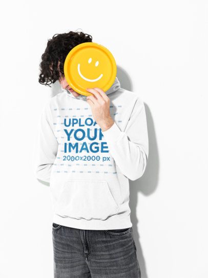 Mockup of a Young Man Wearing a Comfort Colors 1567 Garment-Dyed Hoodie in a White Studio Background m59006