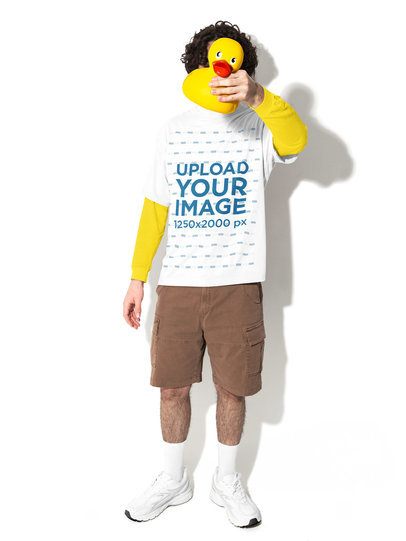 Oversized Tee Mockup Featuring a Man Hiding His Face With a Rubber Duck in a Studio m58992
