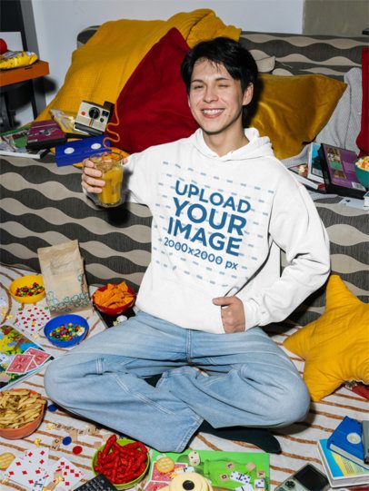 Comfort Colors 1567 Hoodie Mockup Featuring a Cheerful Man With a Drink and Snacks m58527