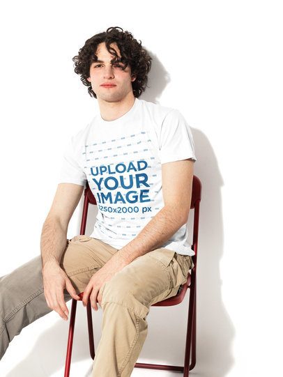 Mockup of a Young Man With Curly Hair Wearing a Comfort Colors 1717 T-Shirt