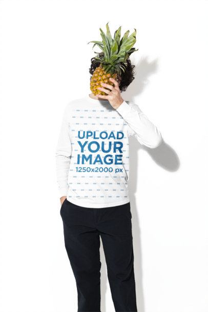 Comfort Colors 6014 Long-Sleeve Tee Mockup Featuring a Man in a Studio Posing With a Pineapple m59018