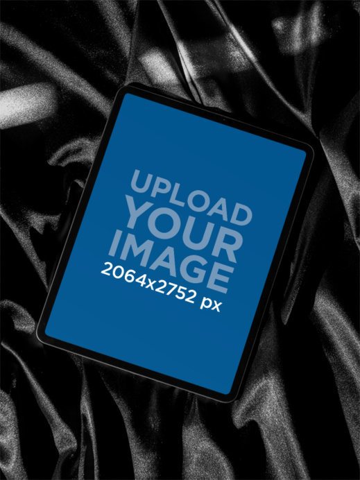 Mockup of an iPad Over a Shiny Black Fabric 