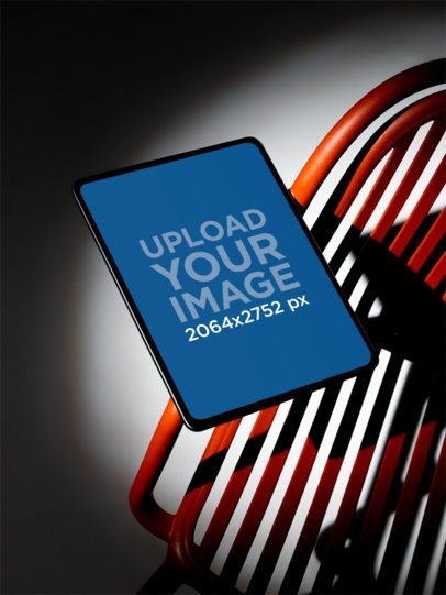Mockup of an iPad Placed on a Colorful Abstract Chair m59459