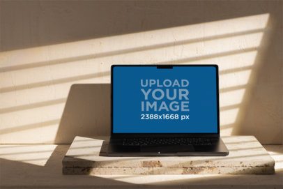 MacBook Mockup Featuring a Light Minimalist Texture-Inspired Setting