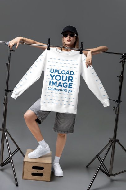 Comfort Colors 1566 Mockup Featuring a Serious Woman Posing With a Sweatshirt