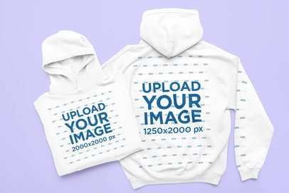 Gildan 18500 Mockup Featuring Two Pullover Hoodies Lying on a Colorful Backdrop m52174