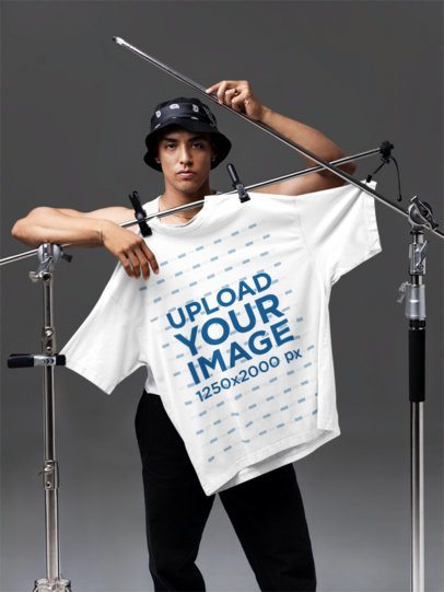 Oversized T-Shirt Mockup of a Man With a Serious Look Posing in a Studio m58792