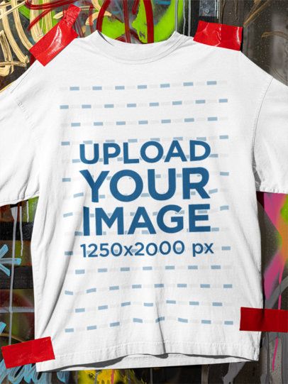 Mockup of an Oversized T-Shirt Mockup Pinned on a Graffiti Wall m59095