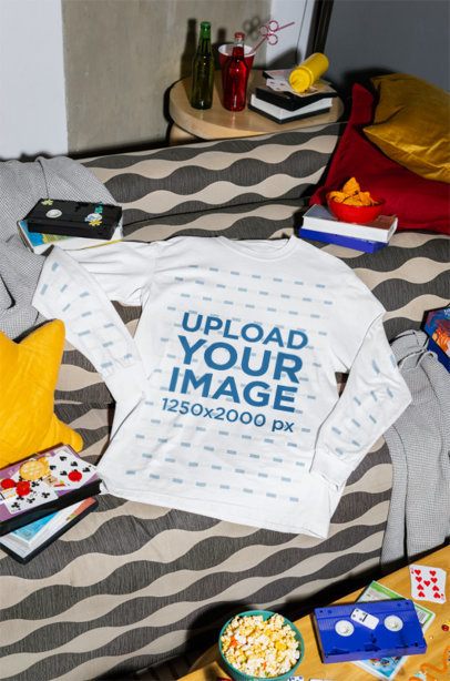 Comfort Colors 6014 Mockup of a Long-Sleeve Tee Lying on a Couch With Snacks