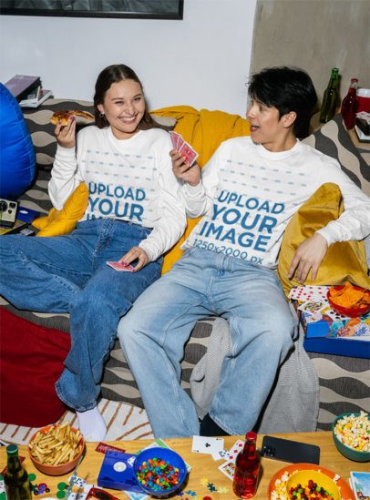 Comfort Colors 6014 Long-Sleeve Tee Mockup Featuring a Happy Woman and a Man Playing Cards and Eating Pizza