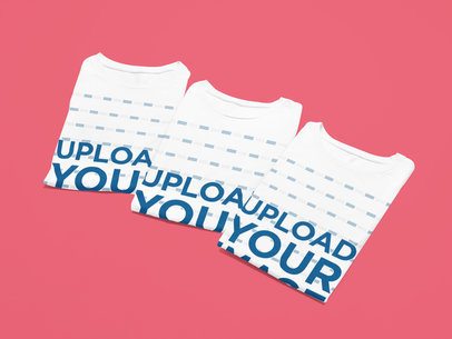 Mockup Featuring Three Folded Bella Canvas 6400 Round-Neck T-Shirts Placed on a Colorful Surface