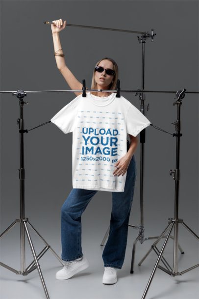 Ghostwear-Themed Mockup of a Woman Posing in a Studio With a Comfort Colors 1717 T-Shirt