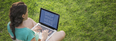 Macbook Pro Mockup of a Woman Sitting on the Grass