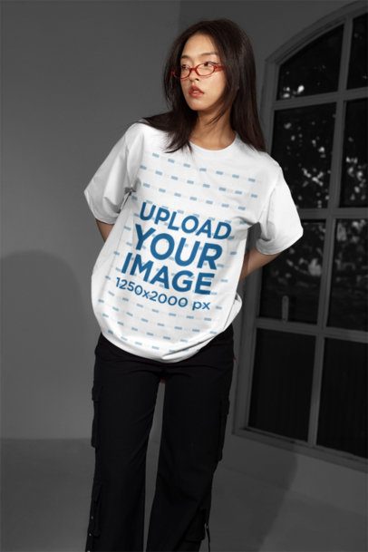 T-Shirt Mockup featuring a Gen Z Woman looking away with her Hands behind her Back m54181