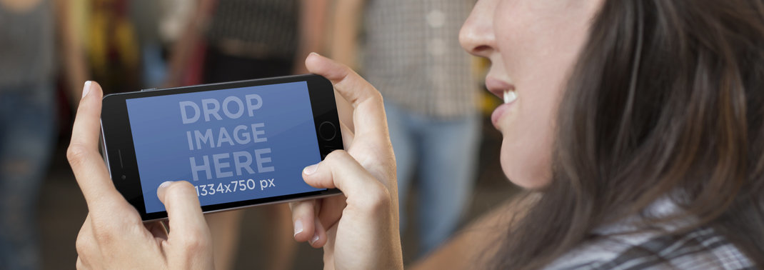 Mockup Template of Young Woman Using iPhone 6 at the Mall