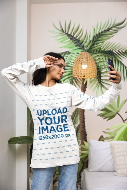 Long Sleeve T-Shirt Mockup featuring a Young Woman taking a Selfie in a Bedroom m55400
