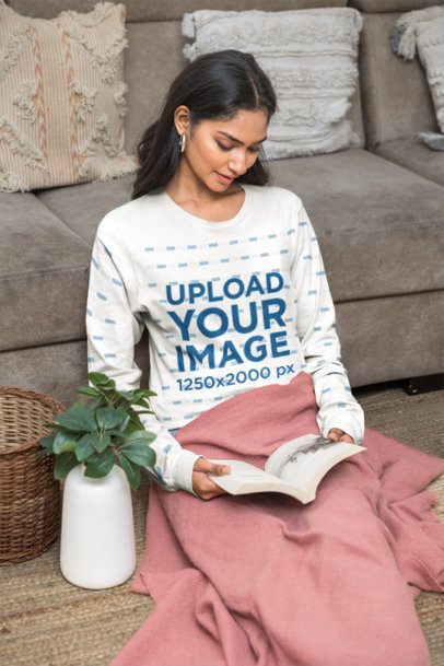 Long Sleeve Shirt Mockup of a Female Model sitting by a Couch with a Pink Blanket m55405