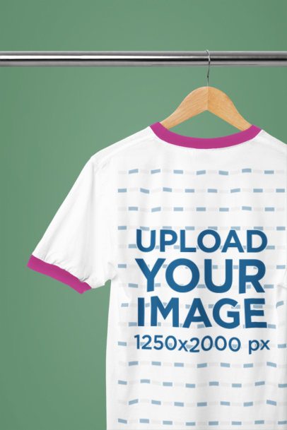 Customizable Two Tone Ringer Tee Mockup on a Clothing Rack with a Solid Color Wall
