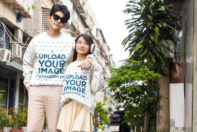 Couples Sweatshirt Mockup featuring a Young Man and Woman Posing Together with a K-Drama Style on an Urban Street m55328