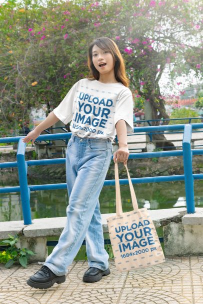 K-Drama Merchandise Mockup with a Woman Wearing a T-Shirt and Carrying a Tote Bag m55311