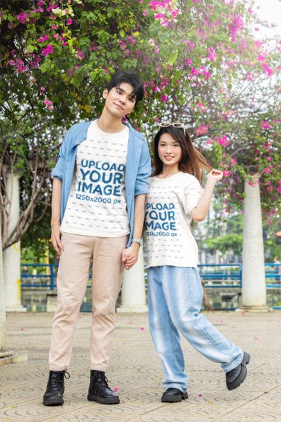 K-Drama T-Shirt Mockup Featuring a Couple Holding Hands at a Park m55312