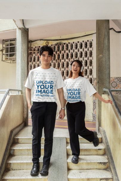 T Shirt Mockup featuring a K-Drama Style Couple Posing on an Outdoor Staircase m55298
