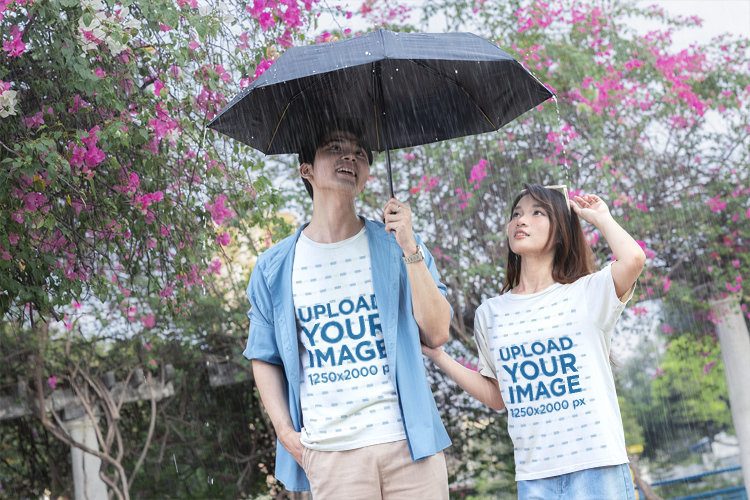 K-Drama Inspired T-Shirt Mockup Featuring a Couple Under an Umbrella in the Rain