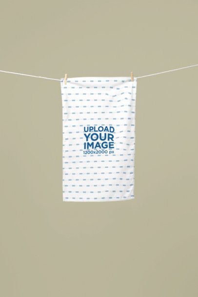 Towel Mockup featuring a Rectangular Towel Hanging on a Clothesline