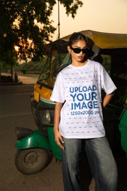 Oversized T-Shirt Mockup of a Stylish Woman Looking Down During Golden Hour m56812