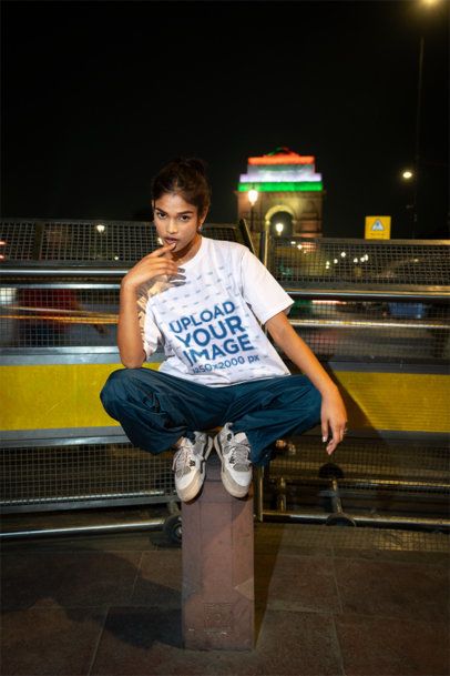 Oversized T-Shirt Mockup with a Stylish Model and Blurred Background Traffic Lights at Night m56846