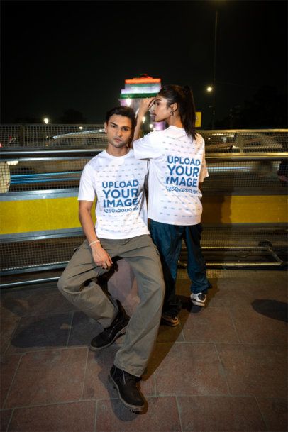 Front and Back T-Shirt Mockup of a Young Couple Posing on an Urban Street With Long Exposed Traffic Lights m56850