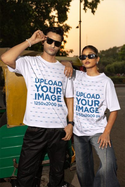 T-Shirt Mockup of a Young Couple Posing With Sunglasses Outdoors at Sunset m56810