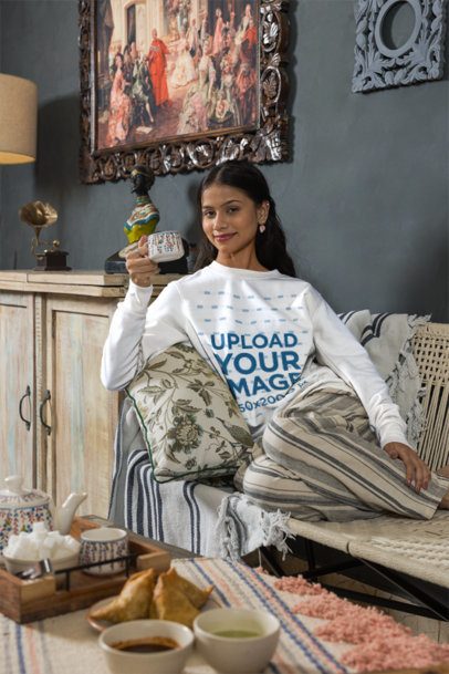 Sweatshirt Mockup Featuring a Smiling Woman Holding a Teacup in a Cozy Living Room m57691