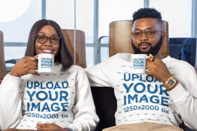 Couples Sweatshirt and Mug Mockup Featuring a Man and Woman Holding Cups in a Lounge Area