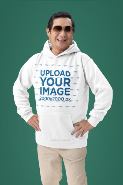 Hoodie Mockup of a Happy Older Man With Hands on His Hips in a Studio Setting