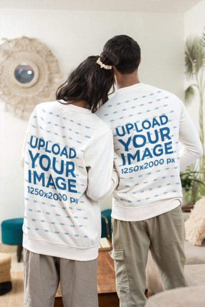 Couples Sweatshirt Mockup Featuring a Woman Resting Her Head on a Mans Shoulder in a Cozy Living Room