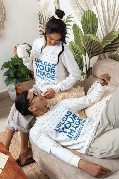 Pullover Mockup Featuring a Young Couple Sharing a Cozy Moment on a Sofa