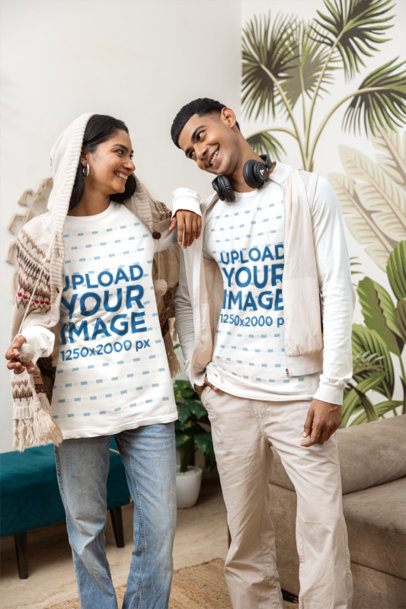 Matching Apparel Mockup of a Woman Leaning on a Man With Headphones in a Living Room