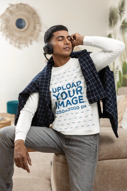 Crewneck Mockup of a Man Enjoying Music With Eyes Closed Indoors