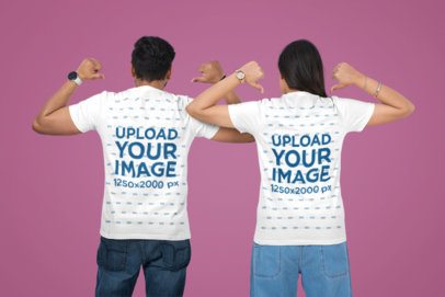 Couples T-Shirt Mockup Featuring a Man and Woman Pointing at Their Backs Against a Customizable Background