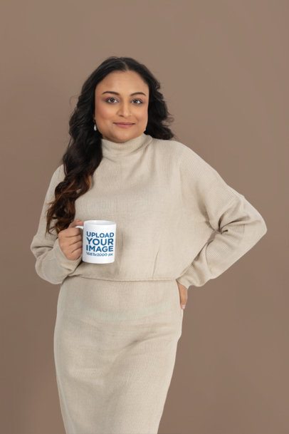 Coffee Mug Mockup Featuring a Woman in a Knit Sweater Holding a Mug  Against a Customizable Background