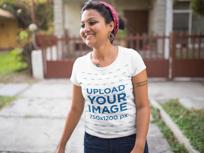 Round Neck Tshirt Mockup Featuring a Smiling Woman Outside a House