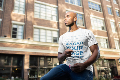 Round Neck T-Shirt Mockup of a Man About to Smoke Outside a Building 18317