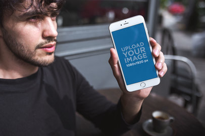 Mockup of a Man with a Beard Showing his Silver iPhone 8 Plus