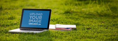 Mockup Of A Macbook Pro Next to a Notebooks at the Garden 