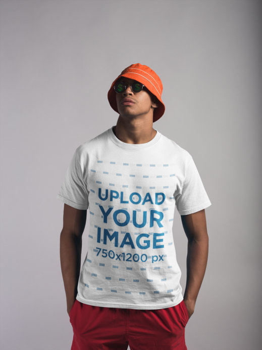 Mockup of a Man Wearing a Round Neck Tee and Beach Clothing