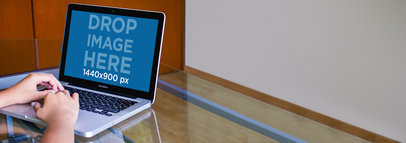 Mockup Template of a Woman Typing on a  Macbook Pro